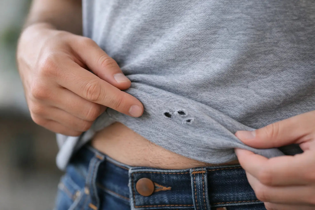 Tiny Holes in Shirt Near Belly Button?